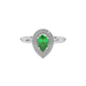 Close-up emerald green gemstone ring, white gold halo setting.