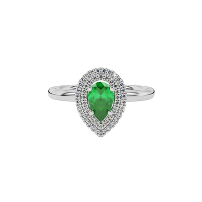 Close-up emerald green gemstone ring, white gold halo setting.