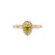 Close-up, pear shape canary yellow gemstone ring, rose gold french pavé halo.