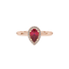 Close-up, pear shape raspberry red gemstone ring, rose gold french pavé halo.