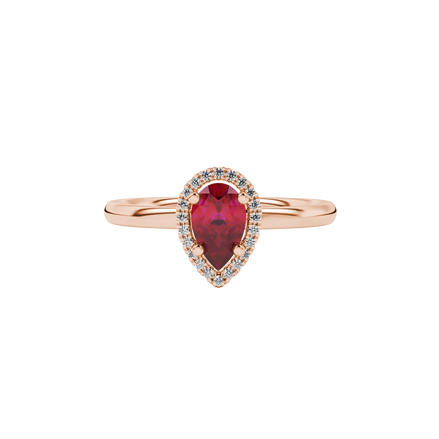 Close-up, pear shape raspberry red gemstone ring, rose gold french pavé halo.