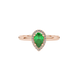 Close-up, pear shape emerald green gemstone ring, rose gold french pavé halo.