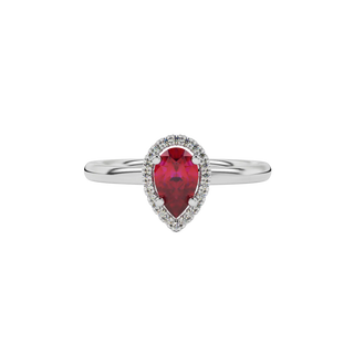 Close-up raspberry red gemstone ring, white gold french pavé halo.