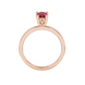 Pear shape raspberry red gemstone ring, rose gold lotus basket setting.