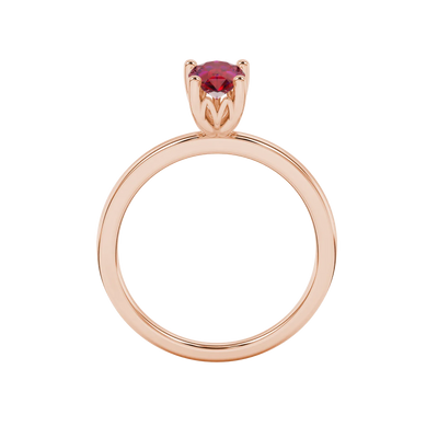 Pear shape raspberry red gemstone ring, rose gold lotus basket setting.