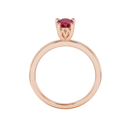 Pear shape raspberry red gemstone ring, rose gold lotus basket setting.