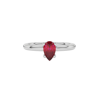 Close-up raspberry red gemstone ring, white gold lotus basket.