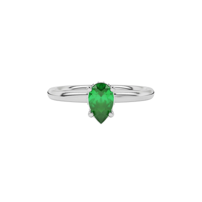 Close-up emerald green gemstone ring, white gold pavé basket.