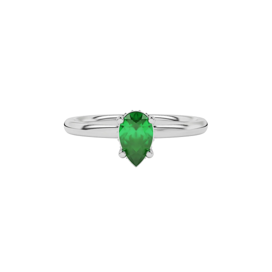 Close-up emerald green gemstone ring, white gold pavé basket.