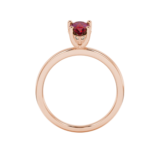 Pear shape raspberry red gemstone ring, rose gold pavé basket setting.