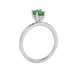 Side profile, white gold emerald green ring, pavé basket gallery.