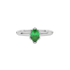 Close-up emerald green gemstone ring, white gold scalloped setting.