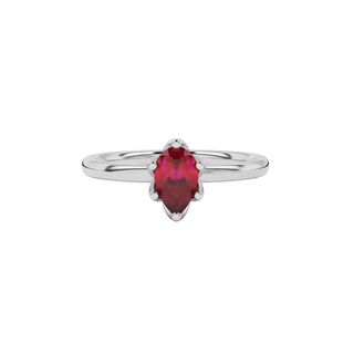 Close-up raspberry red gemstone ring, white gold scalloped setting.