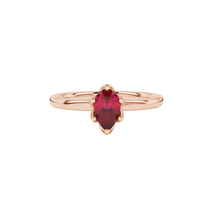 Close-up, pear shape raspberry red gemstone ring, rose gold scalloped setting.