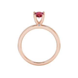 Pear shape raspberry red gemstone ring, rose gold surprise diamond setting.