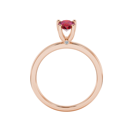 Pear shape raspberry red gemstone ring, rose gold surprise diamond setting.