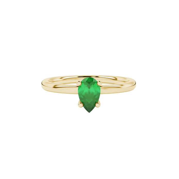 Close-up, pear shape emerald green gemstone, yellow gold surprise diamond ring.