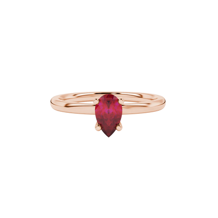 Close-up, pear shape raspberry red gemstone ring, rose gold surprise diamond setting.