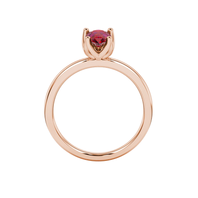 Pear shape raspberry red gemstone ring, rose gold tulip basket setting.