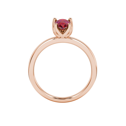 Pear shape raspberry red gemstone ring, rose gold tulip basket setting.