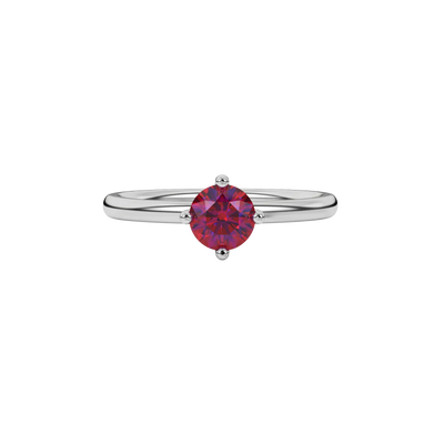 Close-up details of a round raspberry red gemstone secured in a white gold four-prong setting