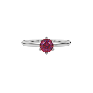 Close-up details of a round raspberry red gemstone secured in a white gold six-prong setting.