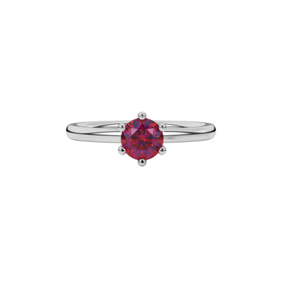 Close-up details of a round raspberry red gemstone secured in a white gold six-prong setting.
