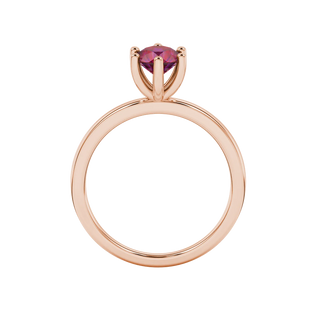 Round-cut raspberry red gemstone solitaire ring in a rose gold six-prong setting.