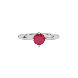 Close-up details of a round raspberry red gemstone secured in a white gold classic basket setting.