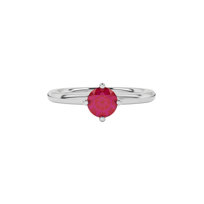 Close-up details of a round raspberry red gemstone secured in a white gold classic basket setting.