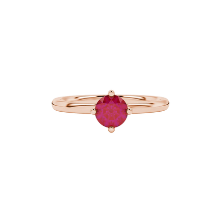 close-up shot of a round raspberry red gemstone ring with a rose gold classic basket design.