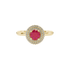 close-up of a round-cut raspberry red gemstone surrounded by a yellow gold diamond falling edge halo.