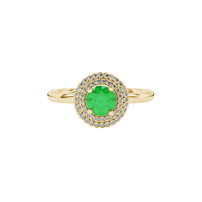 Close-up details of a round-cut emerald green gemstone in a yellow gold diamond falling edge halo.