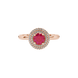 close-up shot of a round raspberry red gemstone ring with a diamond falling edge halo in rose gold.