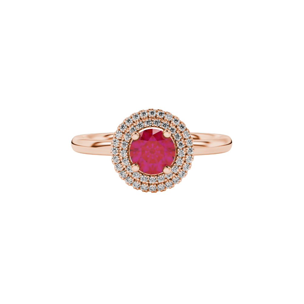 close-up shot of a round raspberry red gemstone ring with a diamond falling edge halo in rose gold.