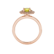 Round-cut canary yellow gemstone solitaire ring in a rose gold falling edge halo diamond setting.