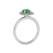 Side view of a white gold emerald green gemstone ring featuring a brilliant falling edge halo.