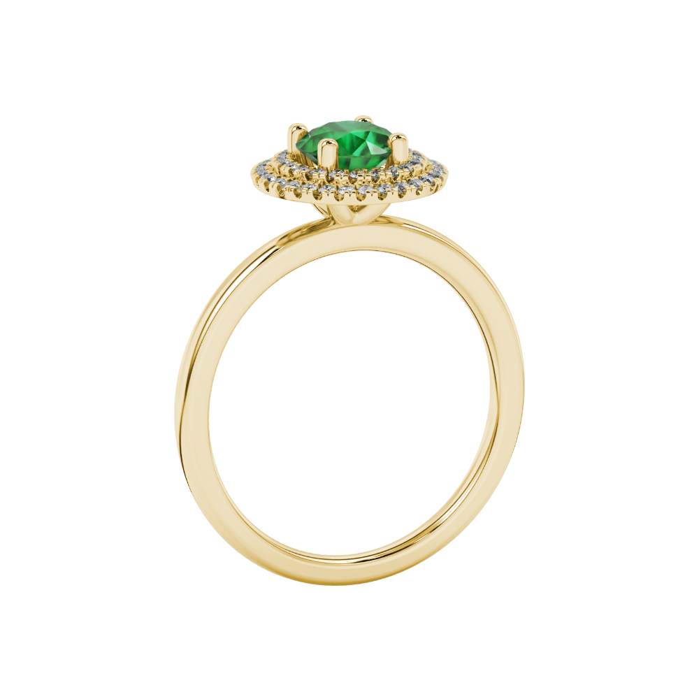 Side profile of a yellow gold emerald green gemstone ring with a falling edge halo design