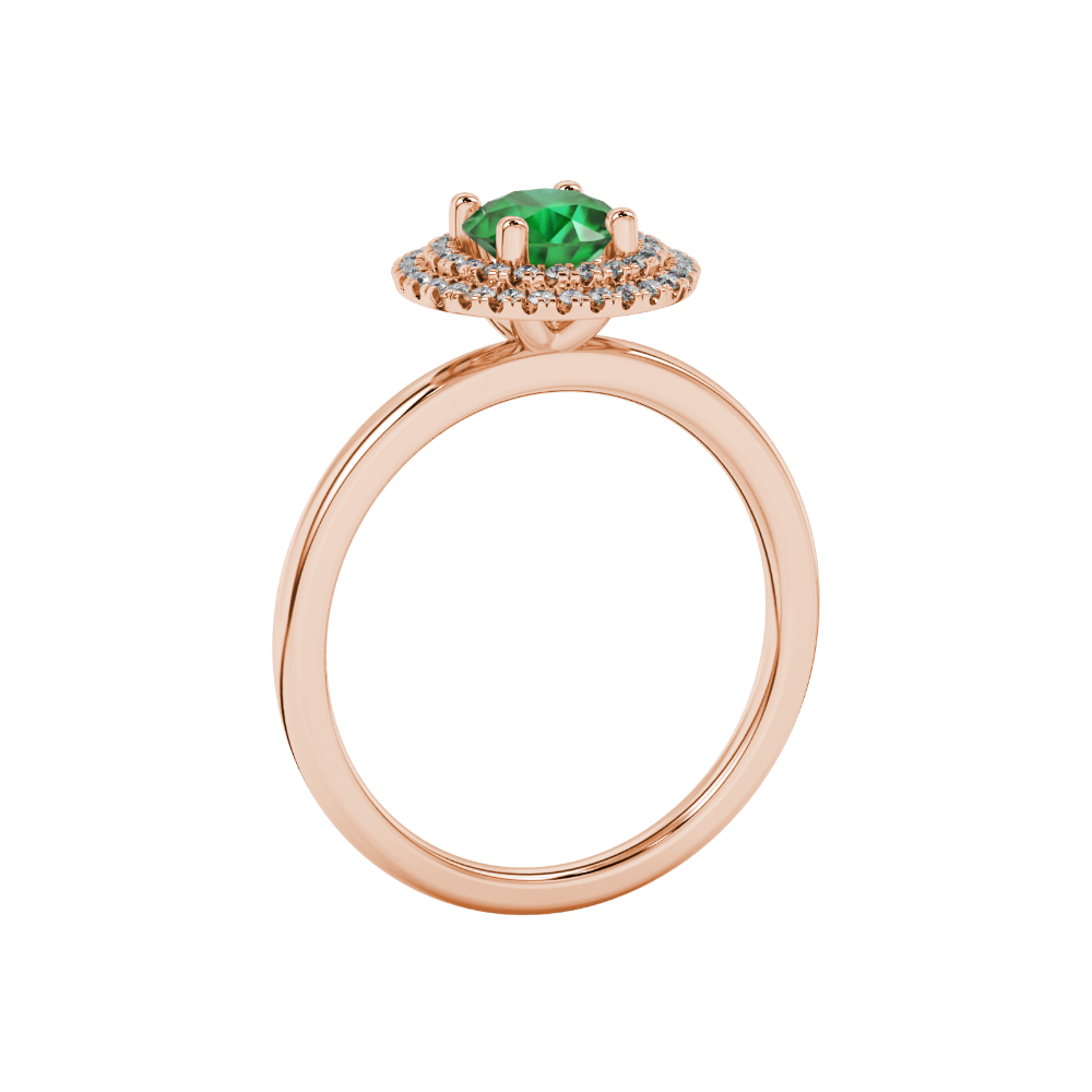 Side angle of a rose gold emerald green gemstone ring showcasing the falling edge halo gallery.