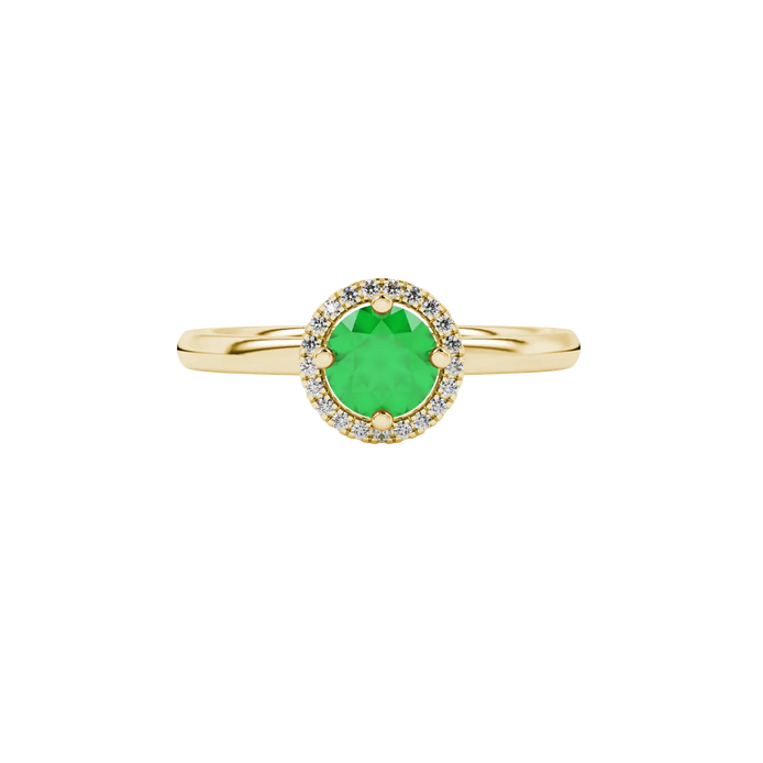 Close-up details of a round-cut emerald green gemstone in a yellow gold diamond French pavé halo.