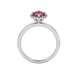 Round-cut raspberry red gemstone solitaire ring in a white gold French pavé halo diamond setting.