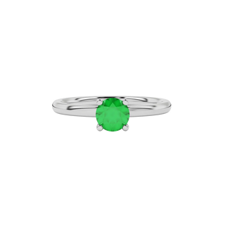 close-up of a round emerald green gemstone enclosed in a white gold lotus basket setting.