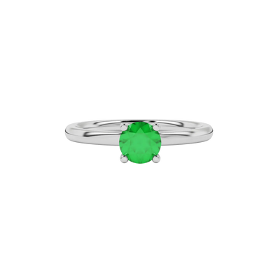 close-up of a round emerald green gemstone enclosed in a white gold lotus basket setting.