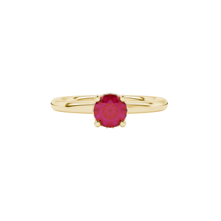 close-up of a round-cut raspberry red gemstone surrounded by a yellow gold diamond pavé basket.