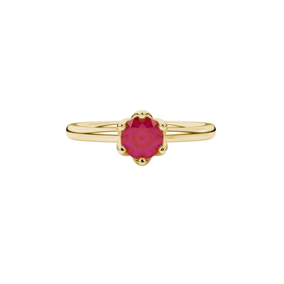 close-up of a round-cut raspberry red gemstone surrounded by a yellow gold scalloped six-prong setting.