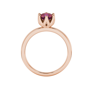 Round-cut raspberry red gemstone solitaire ring in a rose gold scalloped six-prong setting.