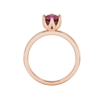 Round-cut raspberry red gemstone solitaire ring in a rose gold scalloped six-prong setting.