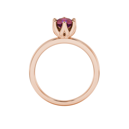 Round-cut raspberry red gemstone solitaire ring in a rose gold scalloped six-prong setting.