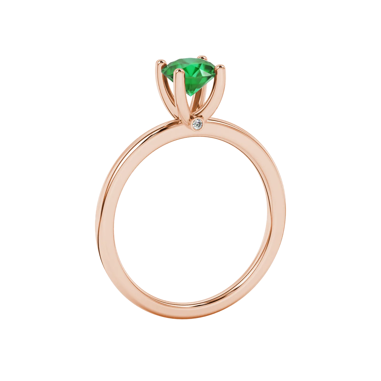 Side angle of a rose gold emerald green gemstone ring showcasing the surprise diamond setting.