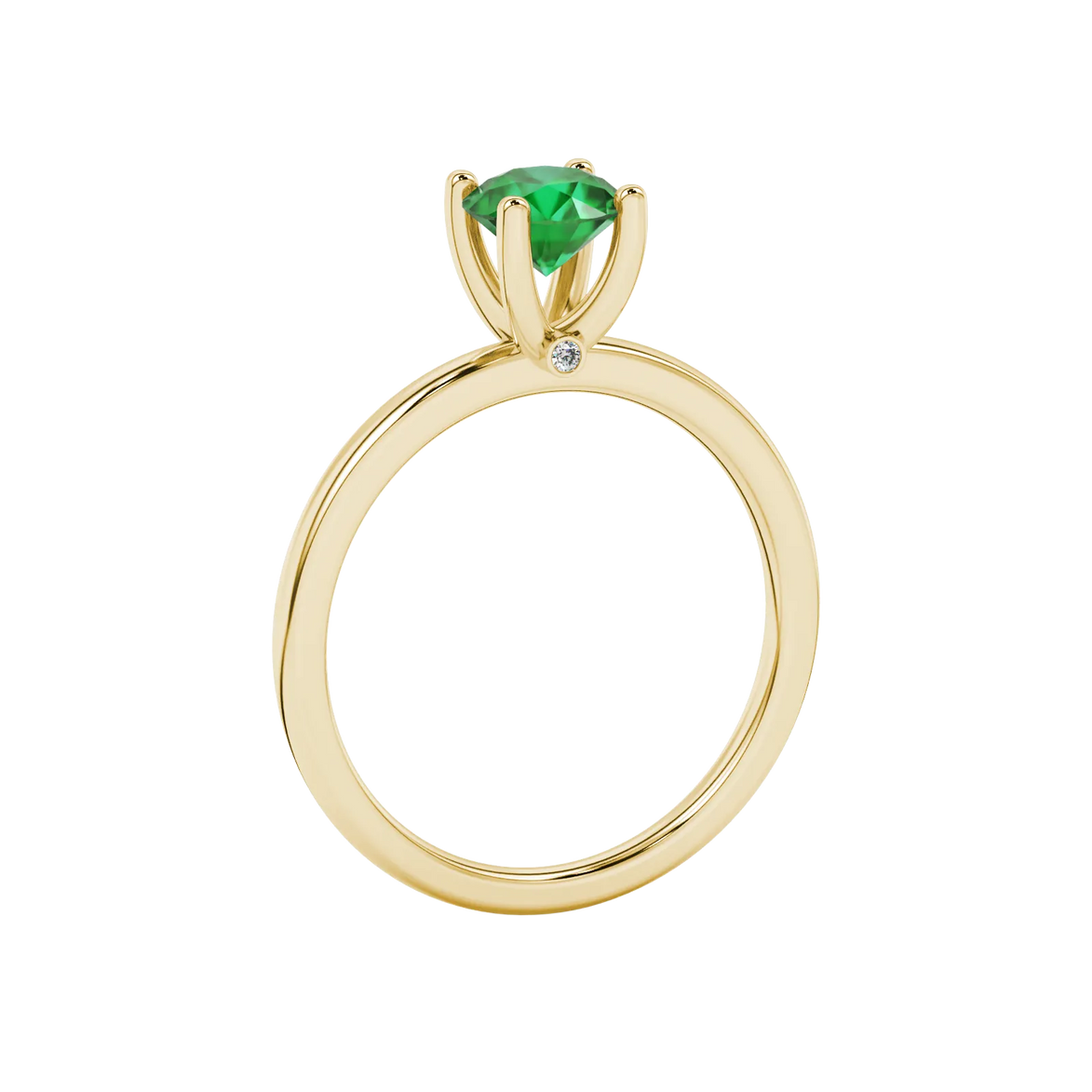 Side profile of a yellow gold emerald green gemstone ring with a surprise diamond design.